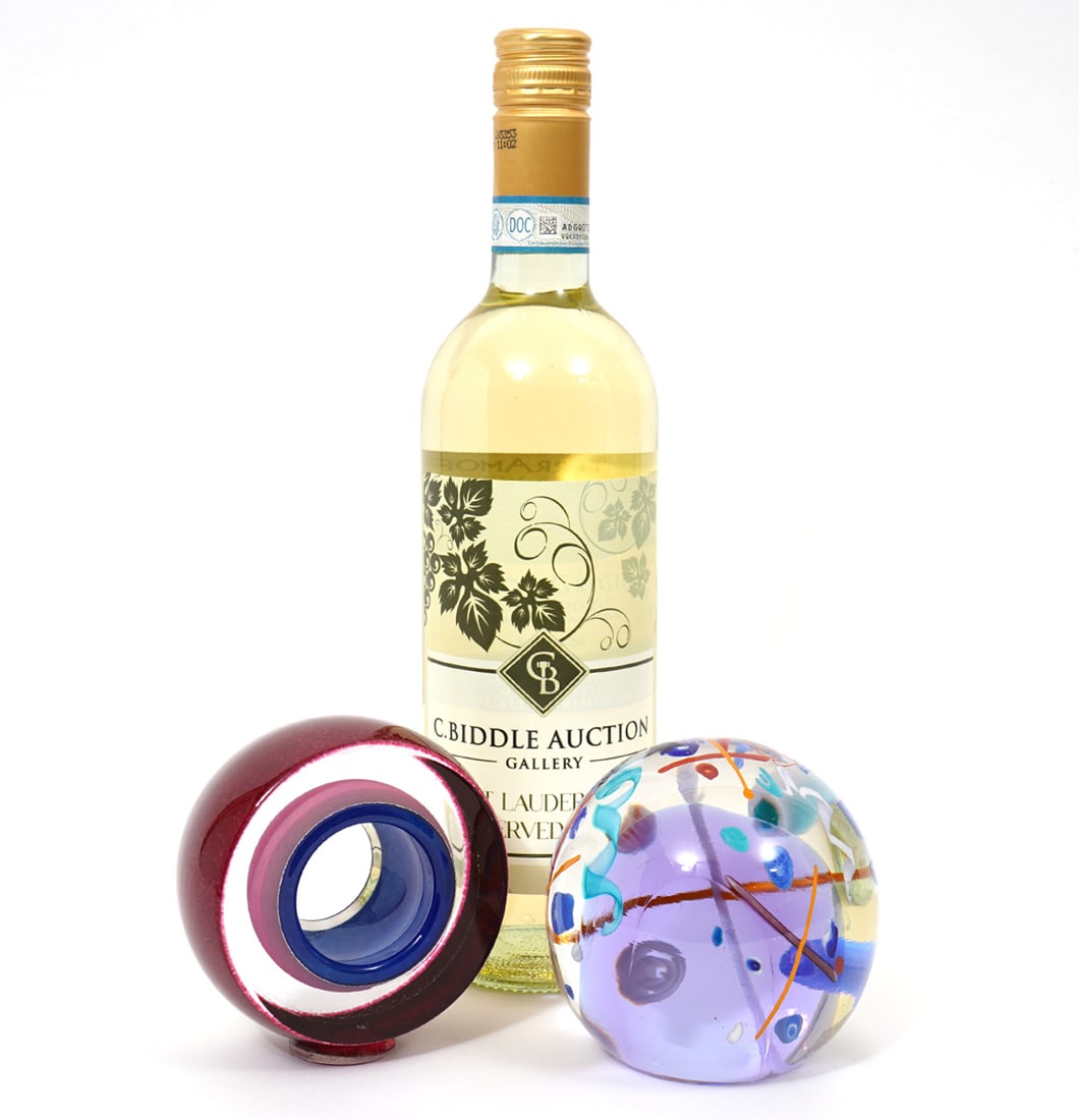Two Modernist Art Glass Signed Paperweights: Two Modernist art glass paperweights includes James Clark signed studio art glass spherical form paperweight (3.5") and Teign Valley Glass Studio (England) circular form paperweight (4"H x 3.5"W). Con
