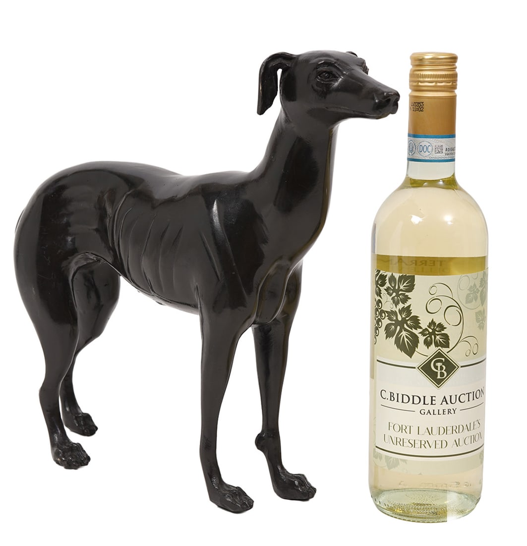 Bronze Whippet Dog Sculpture: Hollow bronze Whippet dog sculpture, unsigned. Measures 11.5"H x 13.5"W. Condition report: Various common scratches and scuffs, please examine all photos closely. Contact C. Biddle Auction Gallery for