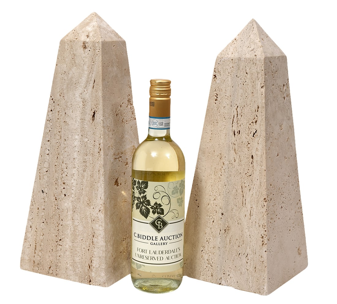 Pair of Italian Travertine Stone Obelisks: Pair of Italian Travertine stone obelisks, measures 15"H x 5.75"W. Condition report: Good condition, please examine all photos closely. Contact C. Biddle Auction Gallery for more detailed information.