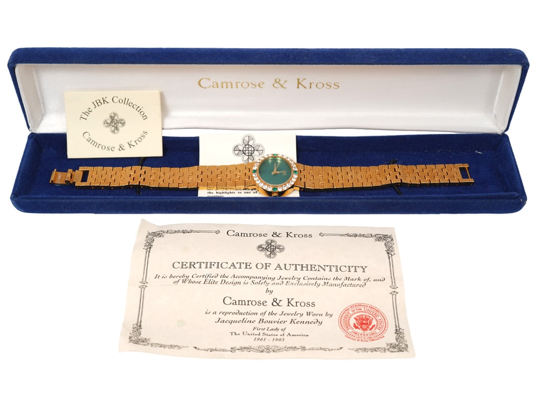 Camrose & Kross Jackie Kennedy Rhinestone Watch: Camrose & Kross gold with gold wovenbands and rhinestones is a reproduction of one owned by Jackie Kennedy. Gold tone with green mother-of-pearl face and clear and green rhinestones on bezel.