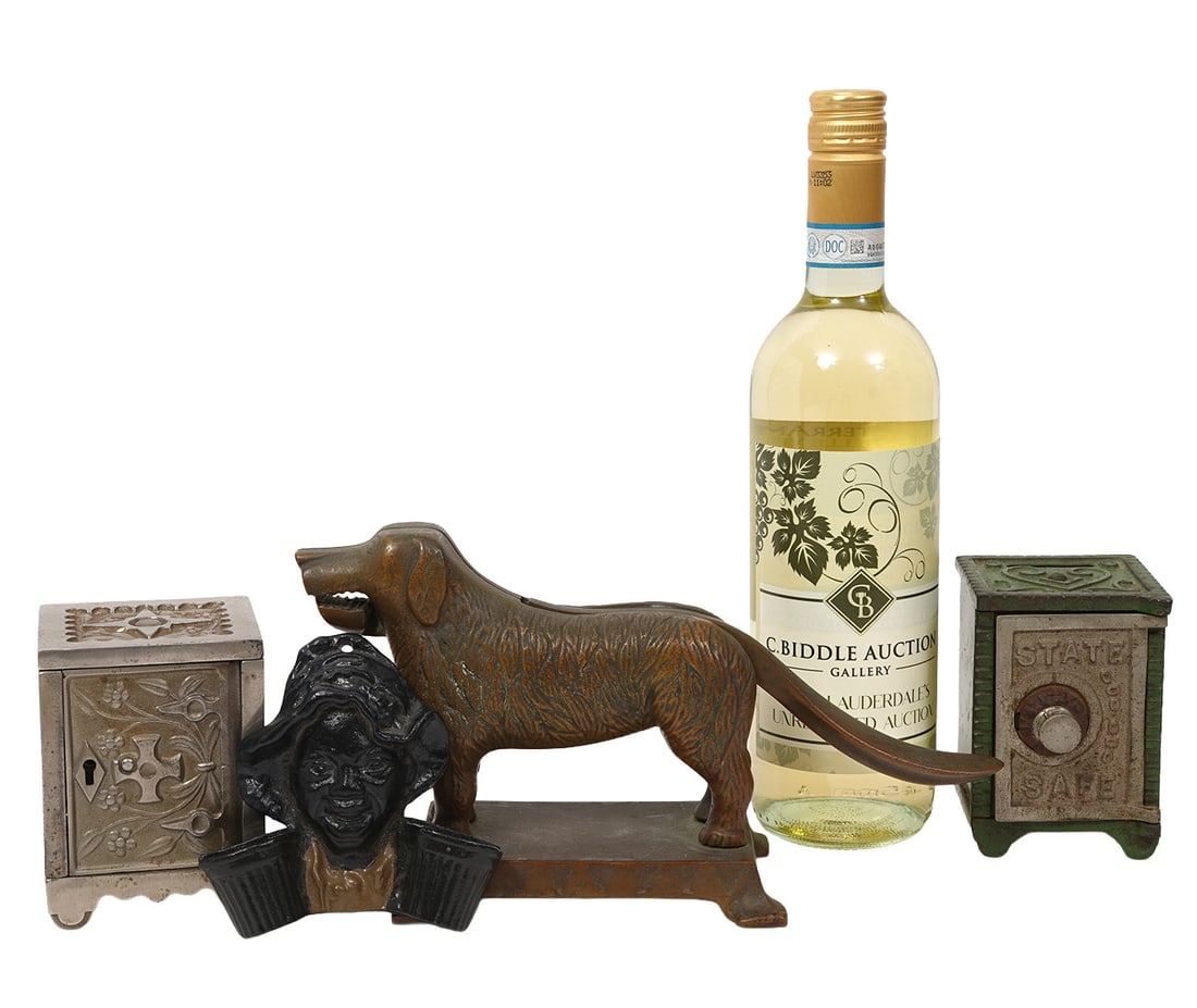 Group of Four Cast Metal Objects: Cast bronze dog nutcracker (5.5"H x 10"W); Two cast iron coin bank safes (4.25"H x 3"L x 3"W); Black Americana wall decoration (4.25"L x 4.25"W). Condition report: Good condition, please examine all