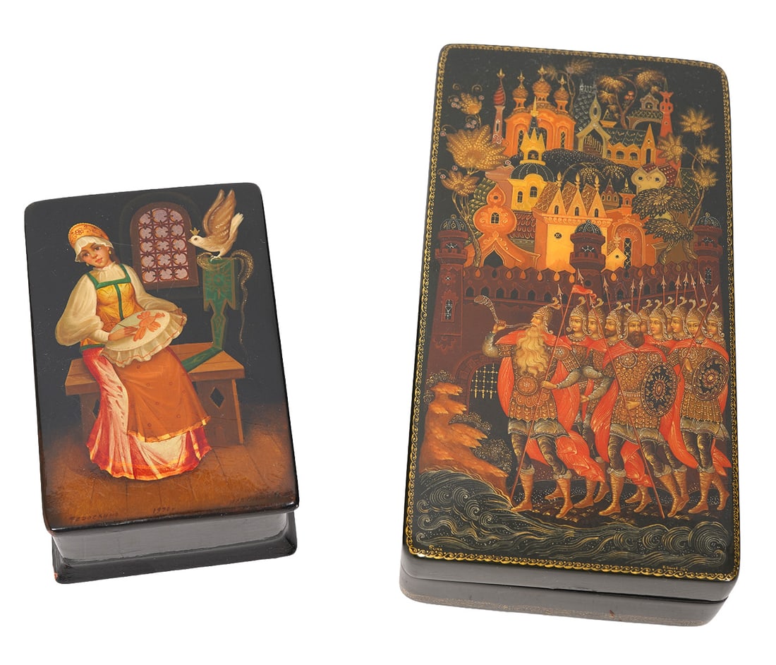 Two Russian Lacquer Boxes: Two Russian Lacquer Boxes includes a large box with scene of warriors near city (5.75 x 3"W) and a smaller box with interior scene of maiden (3.5"L x 2.5"W x 1.75"H). Includes original paperwork insid