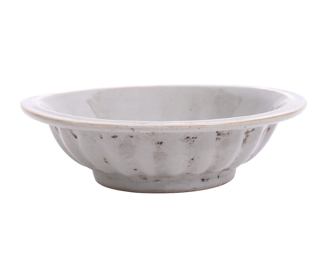 Chinese 'Twin Fish' Celadon Bowl: Chinese 'Twin Fish' celadon pottery bowl measures 6.25"W x 1.75"H. Condition report: Good condition, please examine all photos closely. Contact C. Biddle Auction Gallery for more detailed information.