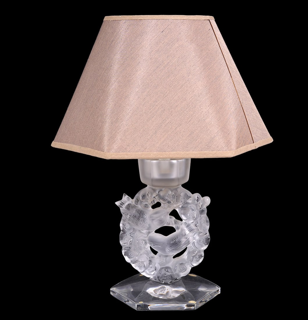 Lalique "Mesanges" Crystal Boudoir Lamp: Lalique "Mesanges" crystal boudoir lamp features two birds and wreath. Measures 8.5"H (with shade 13") x 5"W (shade 9.75"W). Condition report: Good condition, please examine all photos closely. Contac