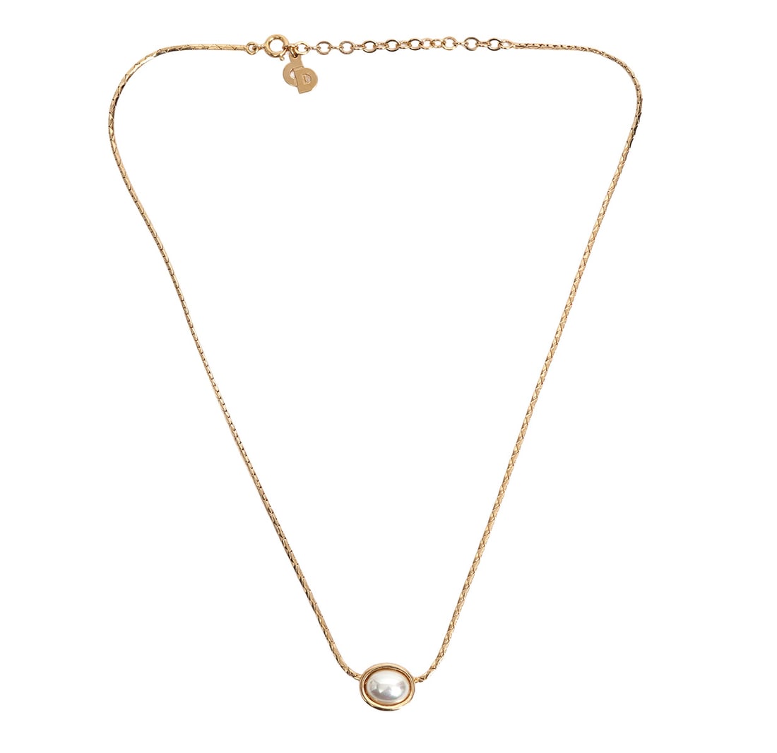 Christian Dior Gold-Tone Faux Pearl Necklace: Christian Dior gold-tone faux pearl necklace measures 17" long. Condition report: Good condition, please examine all photos closely. Contact C. Biddle Auction Gallery for more detailed information. C.
