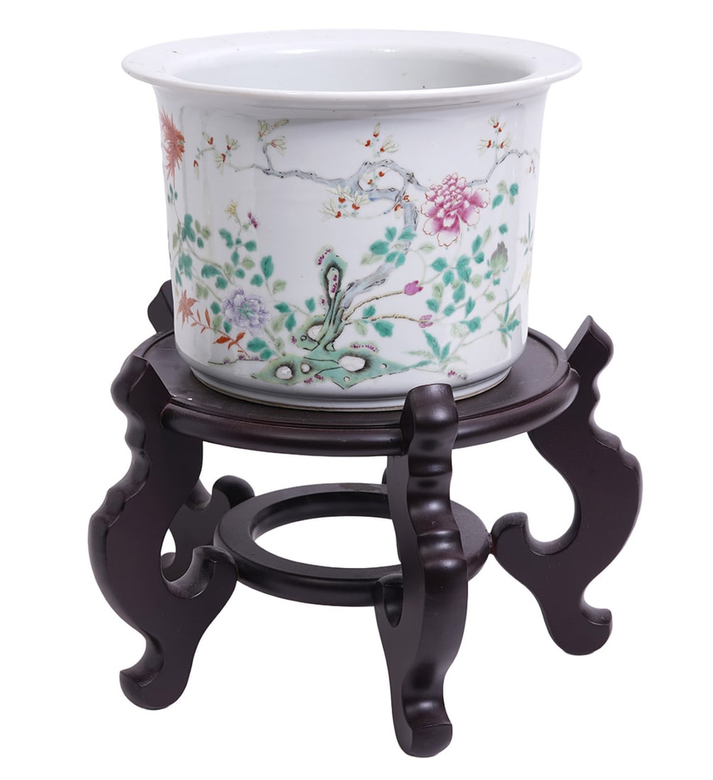 Chinese Famille Rose Flower Pot: Chinese Famille Rose porcelain flower pot has slightly flared top rim, drainage hole bottom center and is decorated with florals and vines. Measures 7 3/8"H x 10 5/8"W. Condition: Good condition, plea