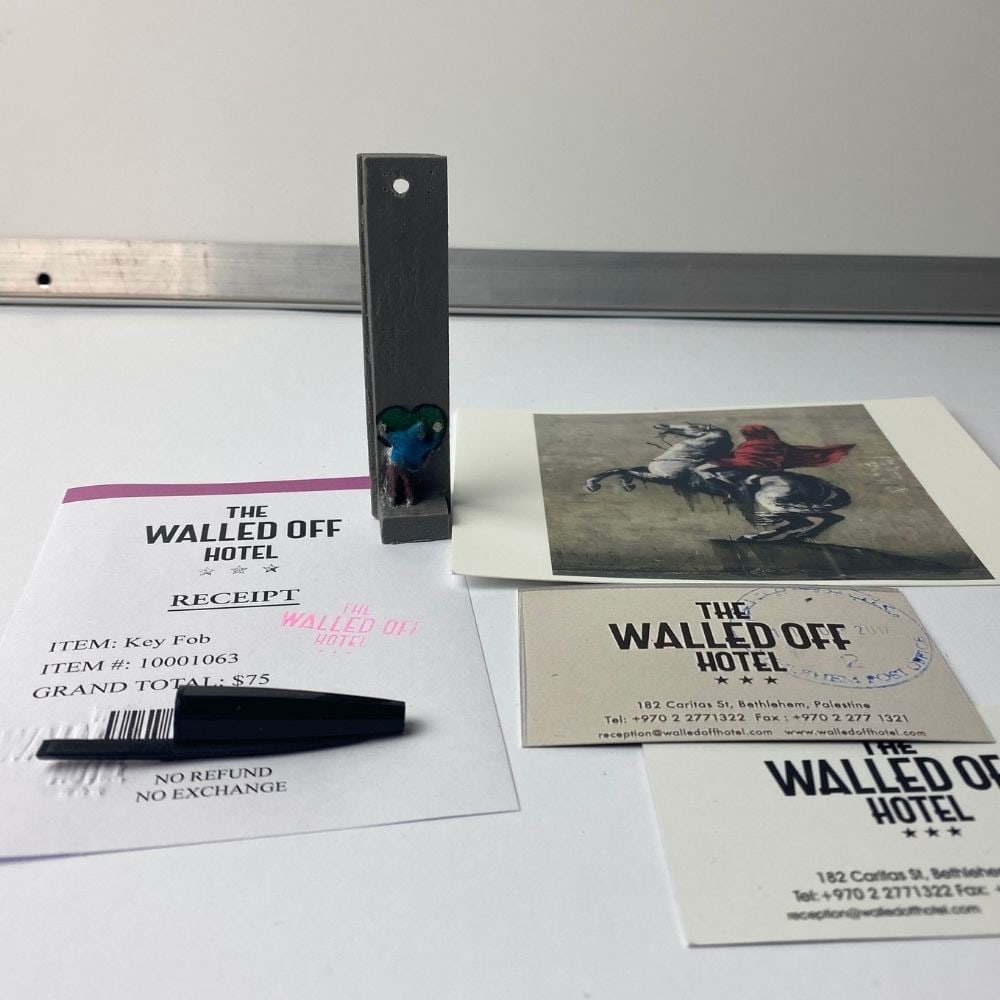 The Walled Off Hotel, Banksy, key Fob Sculpture. Original, Limited Edition,: The Walled Off Hotel, Banksy, key Fob Sculpture. Original, Limited Edition, 2022 New Edition Key Ring Sculpture. The Walled Off Hotel Hand painted. Hand made key fob sculpture. Banksy The Walled