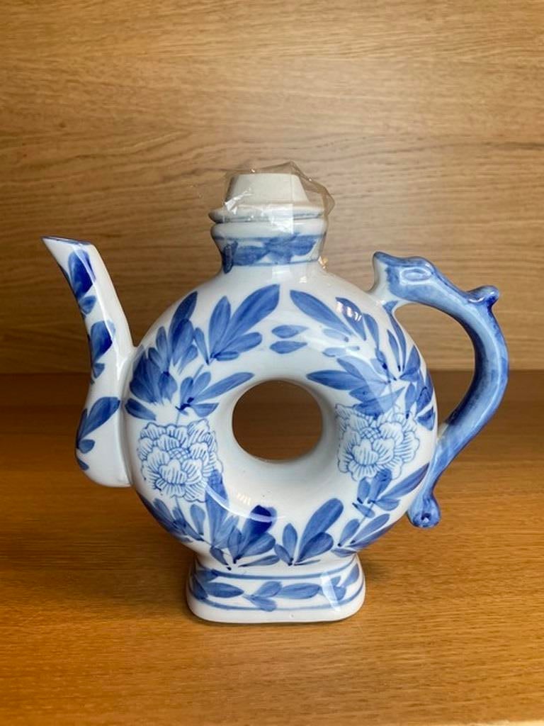 Vintage Chinese hand painted Porcelain Blue and White Teapot/Pitcher Donut Shape: Vintage Chinese hand painted Porcelain Blue and White Teapot/Pitcher Donut Shape. Condition is Used. Shipped with USPS Ground Advantage.