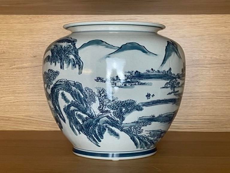 Chinese Blue and White Handpainted Mountain Tree Scenery Porcelain Vase: This is a handpainted Chinese Blue and white porcelain vase. The surface has the theme of ancient Chinese mountain, tree, water and house scenery. The distribution of the color and precise brush outli