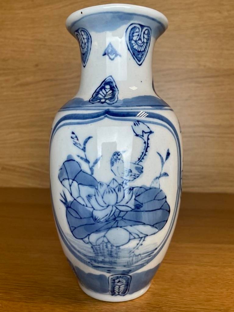 Vintage Chinese Celadon and Blue Porcelain Vase Vintage Chinoiserie Vintage Chinese Porcelain Vintag: This beautiful celadon and blue porcelain Chinese vase is marked and in good vintage condition with no chips, cracks, repairs, crazing, or paint loss. The piece has minor glazing imperfections (shown)