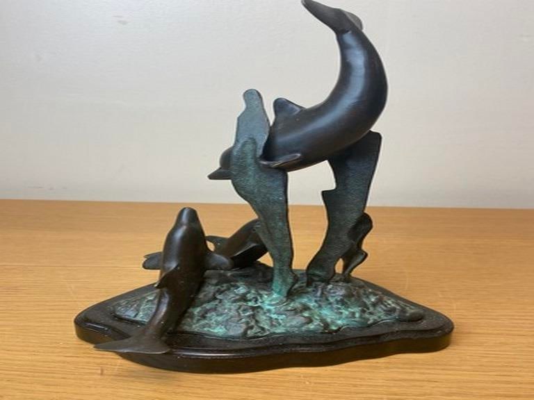 A vintage bronze sculpture depicting dolphins leaping from the water, 20th century. - 3
