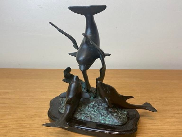 A vintage bronze sculpture depicting dolphins leaping from the water, 20th century. - 4