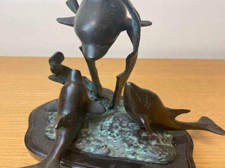 A vintage bronze sculpture depicting dolphins leaping from the water, 20th century. - 5