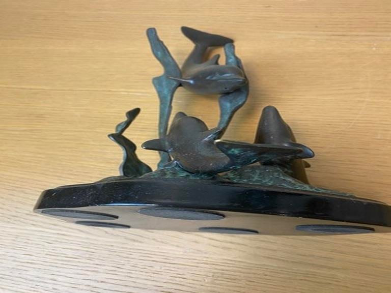 A vintage bronze sculpture depicting dolphins leaping from the water, 20th century. - 6