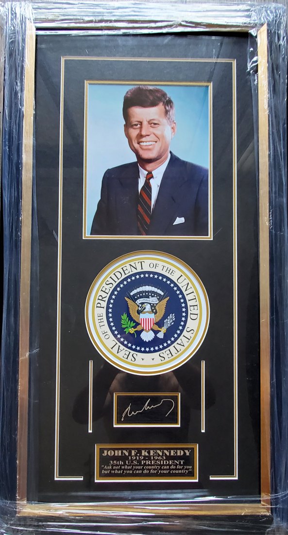 John F. Kennedy JFK Presidential Seal Autograph Framed: This display comes with a professionally printed glossy photo of John F. Kennedy with Presidential Seal & FACSIMILE AUTOGRAPH.It comes in a gorgeous wood frame that measures approx: 30" x 20"