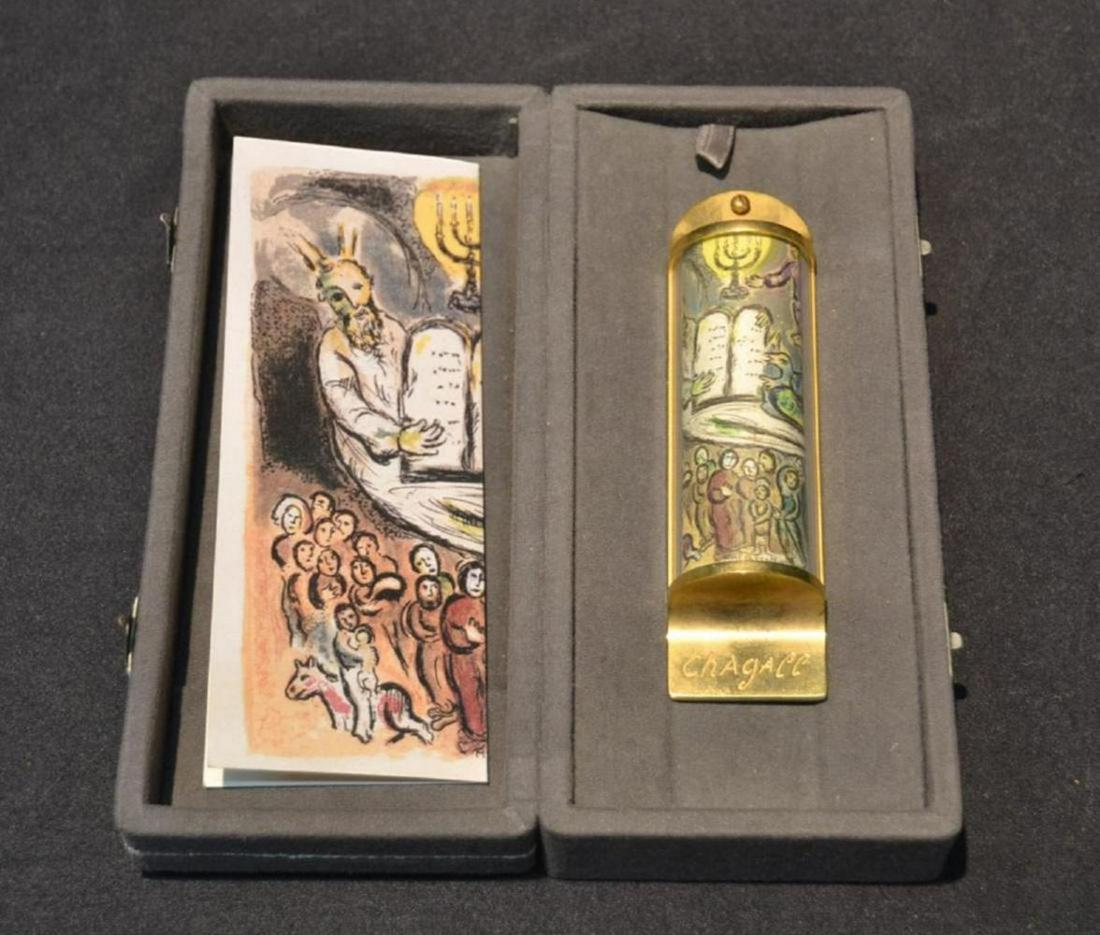 MARC CHAGALL MEZUZAH, 24K GOLD SIGNED, L/E: CASE WITH MEZUZAH 24K GOLD PLATED OVER BRASS FROM "I AM THE LORD THY GOD" ; SIGNED CHAGALL - 1 1/2" x 5 1/2" ; WITH ORIGINAL PRESENTATION CASE & PAPERWORK. PUBLISHED BY ARTA GALLERY, JERUSALEM ISRAEL.