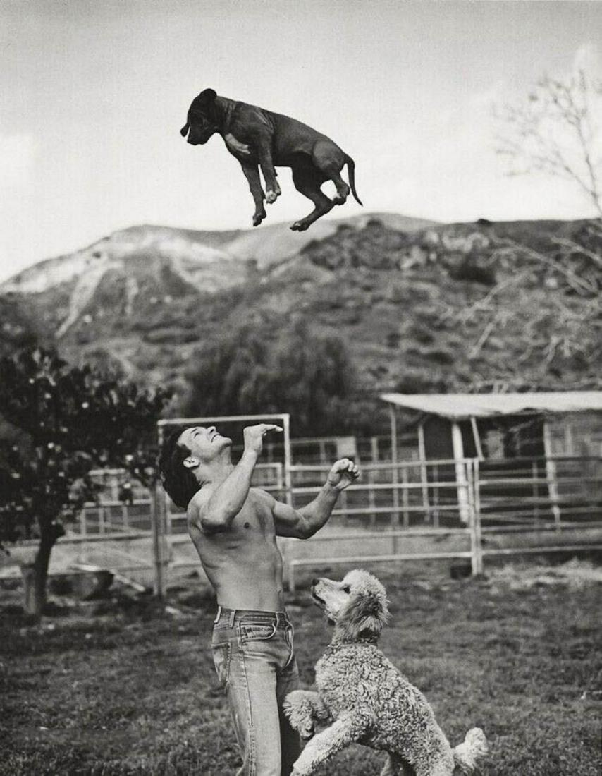 BRUCE WEBER, 1985 PATRICK SWAYZE DOGS: Photographer: Bruce Weber (born 1946) - American fashion photographer and filmmaker best known for his advertising photography for clients Abercrombie & Fitch, Calvin Klein, Pirelli, Ralph Lauren, Rev