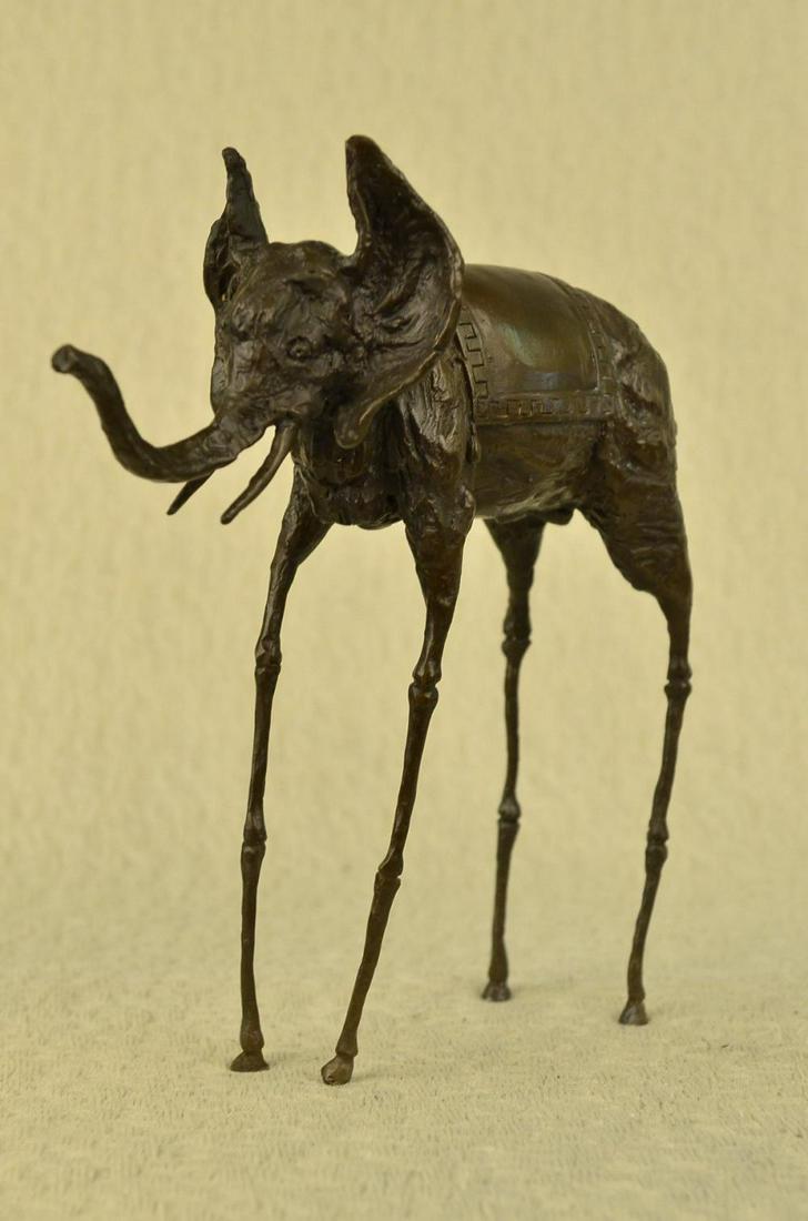 Salvador Dali, (after), "Elephant with Long Legs": Salvador Dali, (after) "Elephant with Long Legs" Bronze Sculpture Signed: Foundry signed on the bronze Bronze Dimensions : Height 12" X Width 12" Weight : 6 LBS Salvador Domingo Felipe Jacinto Dalí i