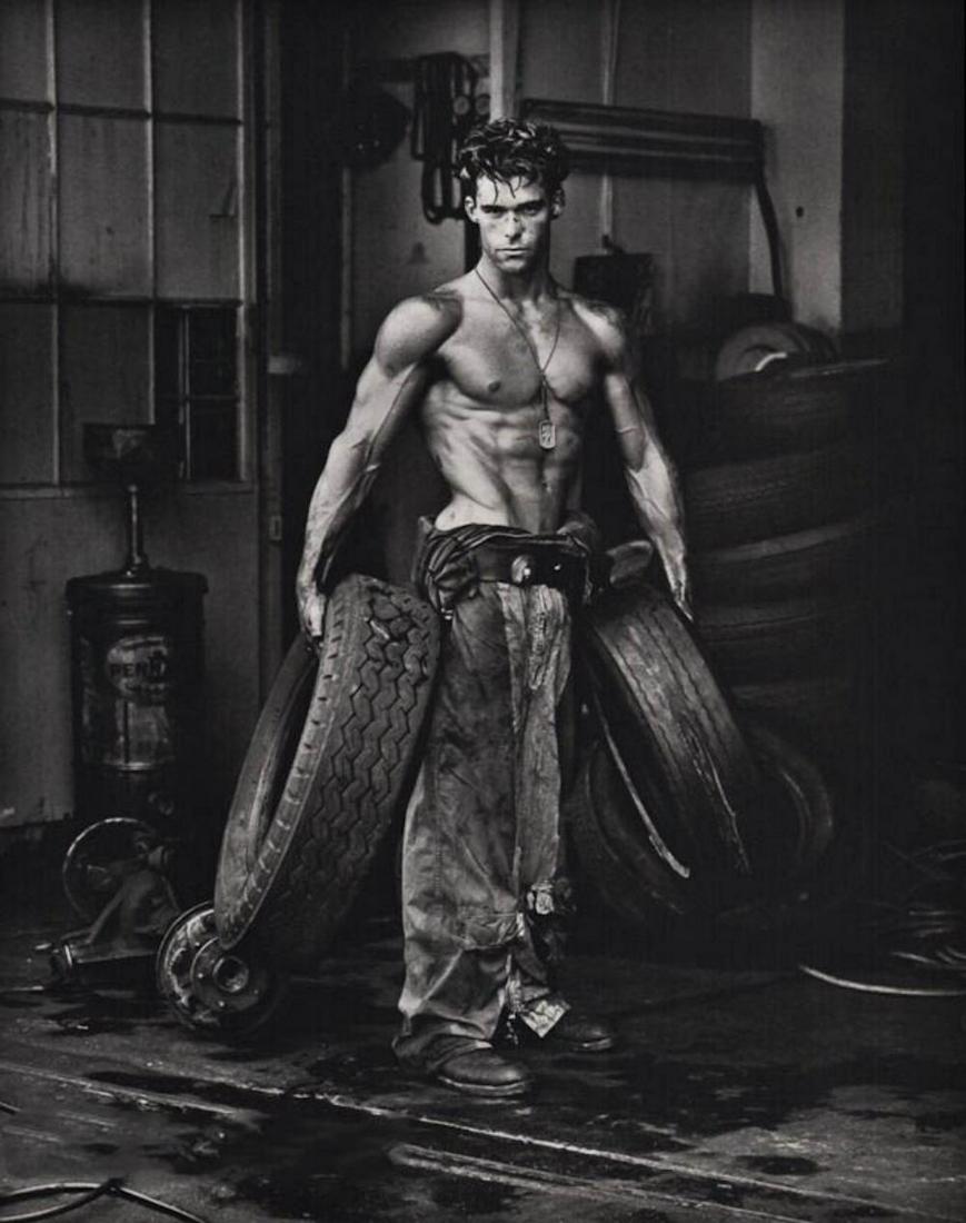 HERB RITTS, Male Semi Nude Fred With Tires: Photographer: Herbert "Herb" Ritts (American, 1952 - 2002) - renowned fashion, art and celebrity photographer. Subject: Fred with Tires, Hollywood. Date Of Negative: 1984 Type Of Print: Quadtone Photo