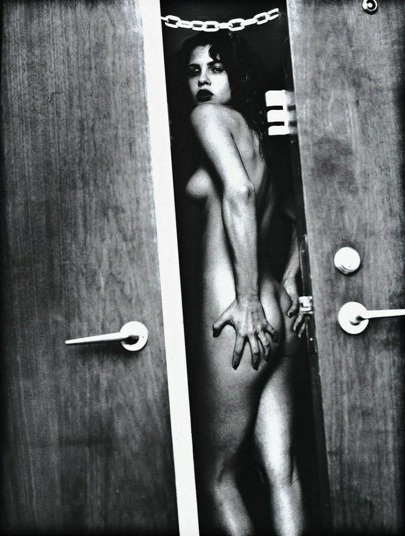 Helmut Newton, 1987 Nude Woman Fashion Door: Photographer: Helmut Newton (Germany, 1920 - 2004) - best known for his erotically charged highly stylized images, Helmut Newton was one of the most influential fashion photographers of all time. Subj