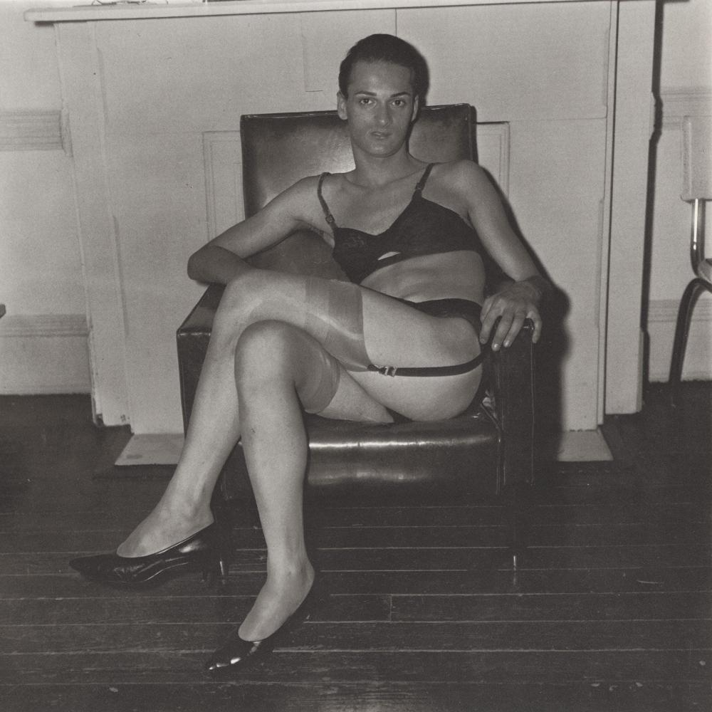DIANE ARBUS - Seated Man in Bra and Stockings, 1967: Photographer: Diane Arbus Born: March 14, 1923, New York, New York, United States. Died: July 26, 1971, Westbeth Artists Housing, New York, United States. Diane Arbus was an American photographer. Arb