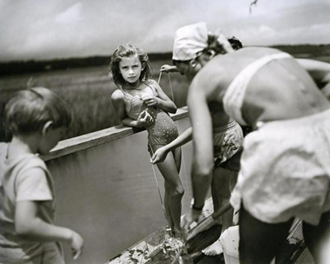 SALLY MANN, Crabbing at Pawley's, 1989: Photographer: Sally Mann is an American photographer, widely known for her large-format, black-and-white photographs—at first of her young children, then later of landscapes suggesting decay and dea