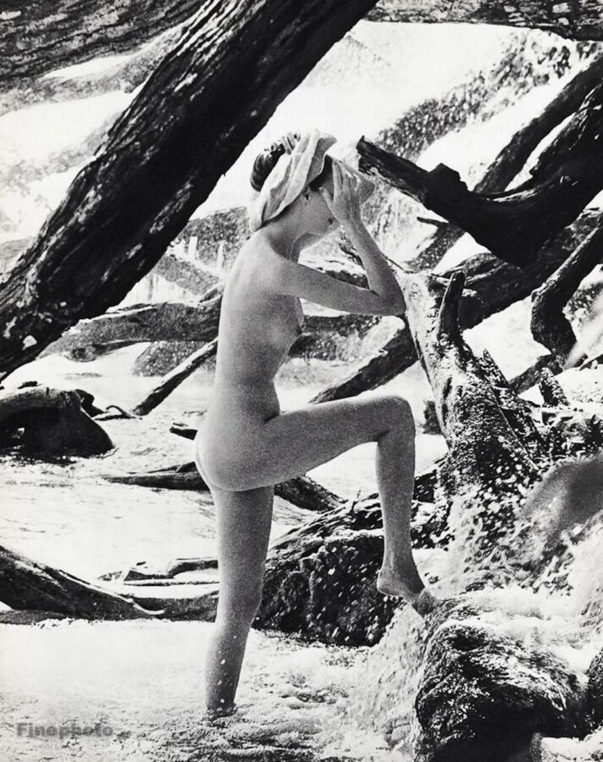 John Rawlings, 1966 Waterfall Female Nude: About the Photographer: John Rawlings (1912-1970) was a Condé Nast Publications fashion photographer from the 1930s through the 1960s. Rawlings left a significant body of work, including 200 Vogue ma