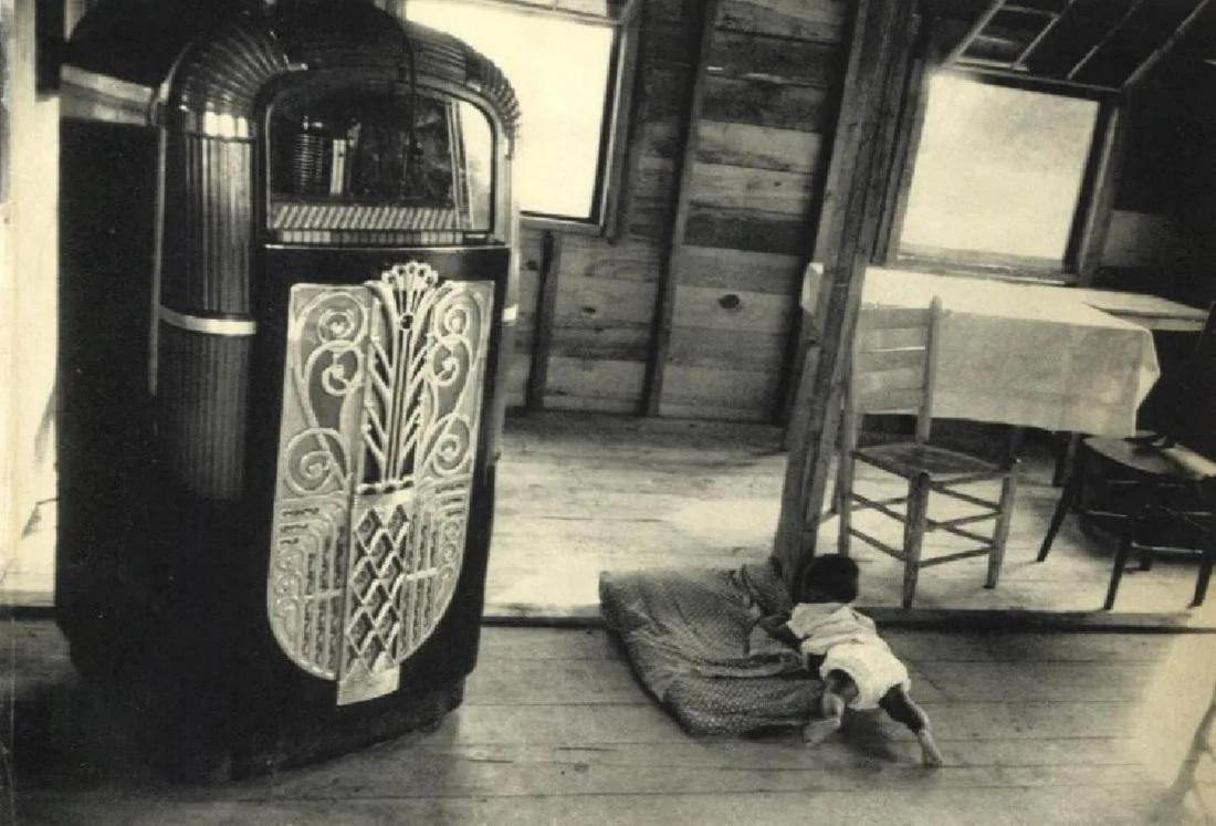 Robert Frank, Cafe, Beaufort, South Carolina, 1955: Photographer: Robert Frank (1924-2019) was a Swiss photographer and documentary filmmaker, who became an American binational. His most notable work, the 1958 book titled The Americans, earned Frank co