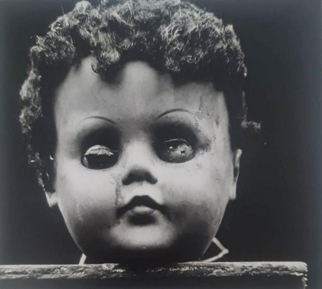Ralph Eugene, Brunette doll's head, 1959: Photographer: Ralph Eugene Meatyard (May 15, 1925 - May 7, 1972) was an American photographer from Normal, Illinois, U.S. Meatyard purchased his first camera in 1950 to photograph his newborn first ch