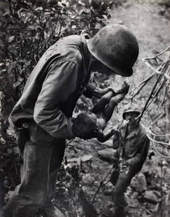 W. Eugene Smith, Saipan (Soldier Holding Baby), 1944: Photographer: Vivian Dorothy Maier, (1918-1978) William Eugene Smith was an American photojournalist. He has been described as "perhaps the single most important American photographer in the developme