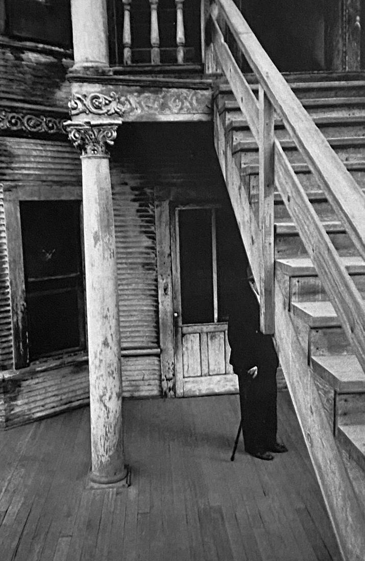Robert Franks, Rooming House- Bunker Hill, Los Angeles, 1956: Photographer: Robert Frank (1924-2019) was a Swiss photographer and documentary filmmaker, who became an American binational. His most notable work, the 1958 book titled The Americans, earned Frank co