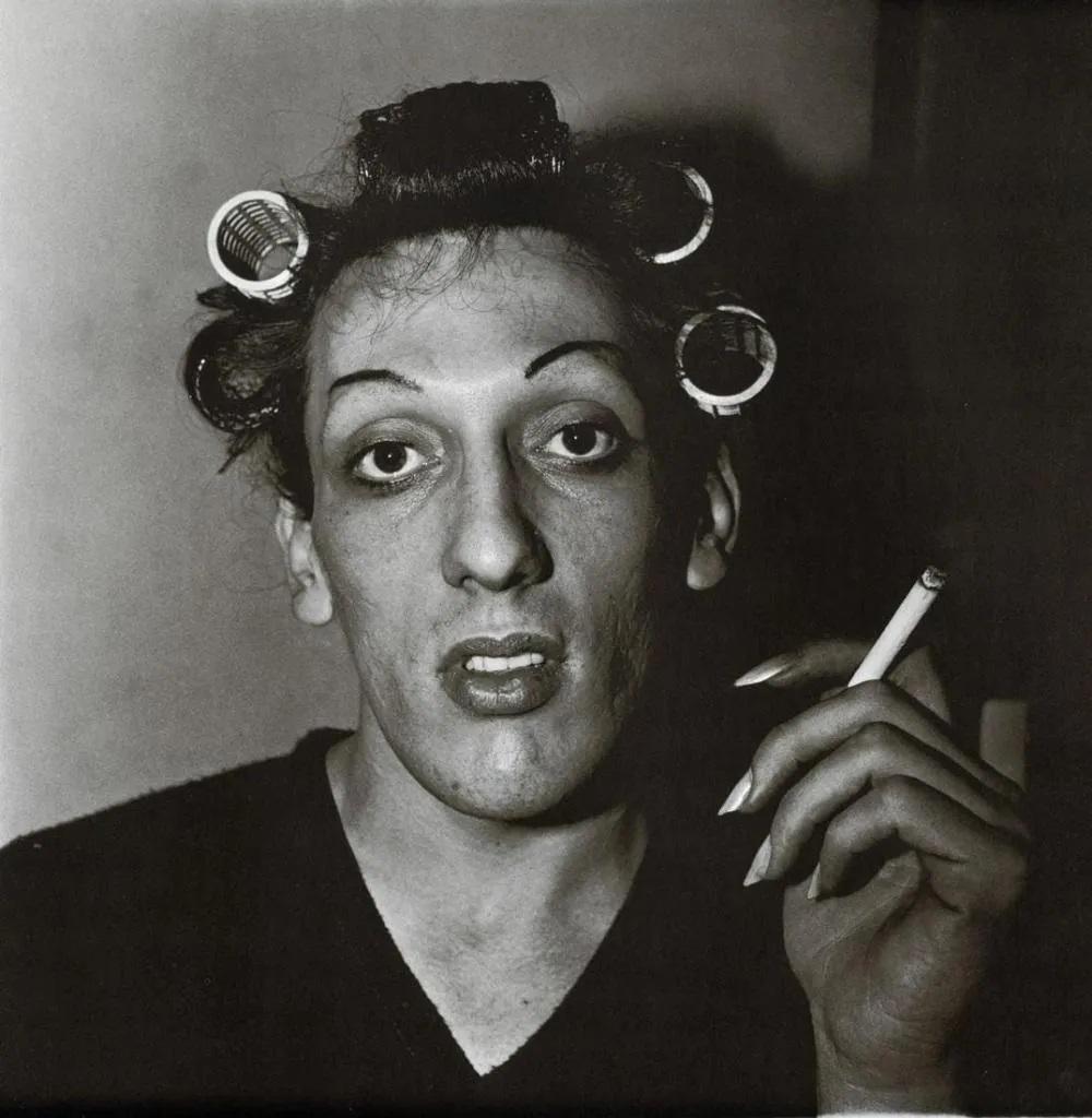 DIANE ARBUS - A Young Man In Curlers at Home, 1966: Photographer: Diane Arbus Born: March 14, 1923, New York, New York, United States. Died: July 26, 1971, Westbeth Artists Housing, New York, United States. Diane Arbus was an American photographer. Arb