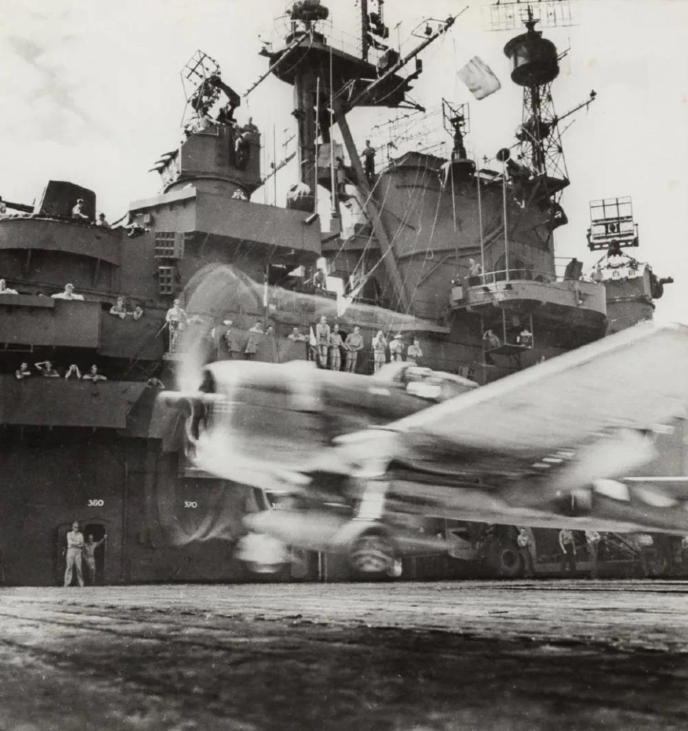 EDWARD STEICHEN - GRUMMAN F6F HELLCAT TAKES OFF, 1943: Photographer: Edward Steichen (American, 1879 - 1973) - Internationally renowned and historically significant photographer.. Title: Grumman F6F Hellcat takes off Date Of Negative: 1943 Type Of Print: