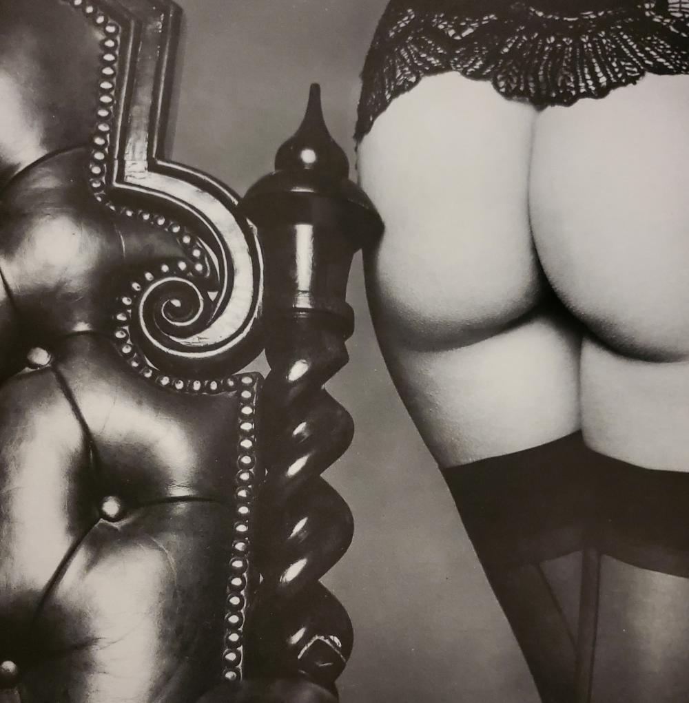 John Swannell, Butt by the Bedpost, 1980's: Photographer: John Swannell was born in 1946. After leaving school at 16, he worked first as an assistant at Vogue Studios and then assisted David Bailey for four years before setting up his own studi