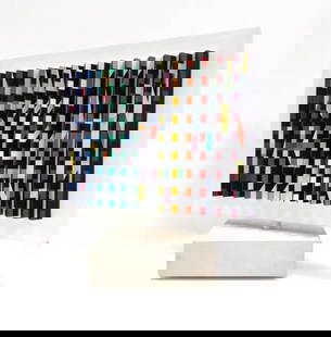 Yaacov Agam 'DOUBLE SIDED POLYMORPH KENETIC SCULPTURE': Double sided spinning polymorph kinetic sculpture made with silkscreen on folded PVC. Measures 11.5 x 12.75 x 4.75 inches including wooden base. Hand signed and numbered by Yaacov Agam on the undersid