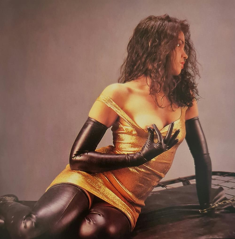 Eric Kroll, Golden dress, 1990's: Photographer: Eric Kroll - 1946 (age 75 years), Eric David Kroll is a fetish photographer, erotica historian and book editor who has lived in New York, San Francisco, and Los Angeles. Subject/Title: G