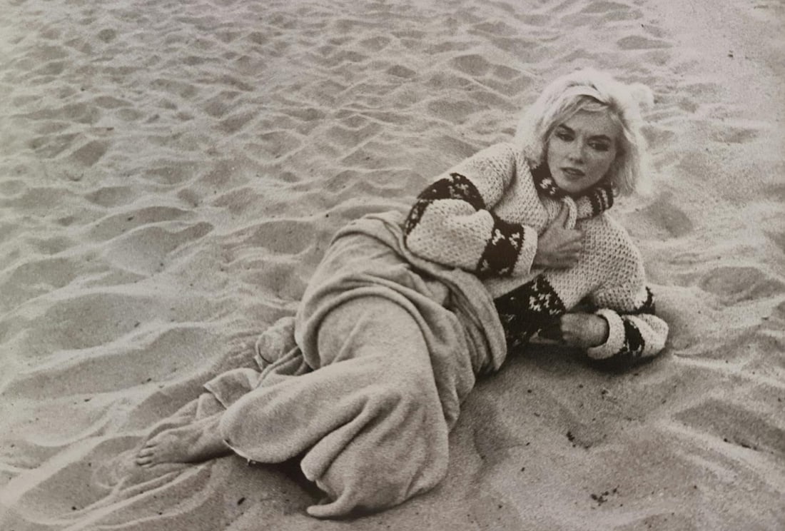 Marilyn Monroe in repose on beach: Photographer: George Barris Subject/Title: Marilyn Monroe in repose on beach Date Of Negative: Undated Type Of Print: Authentic Vintage Sheet Fed Photogravure/Heliogravure Date Of Print: 2000 Publishe