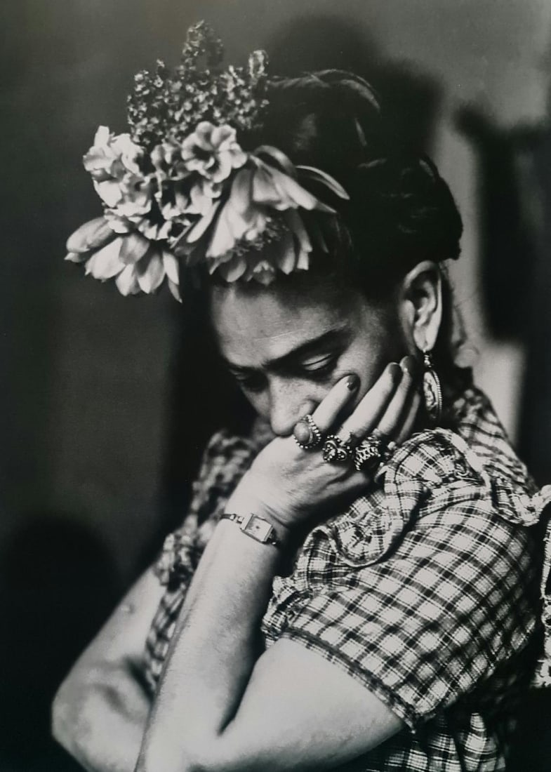 FRIDA KAHLO, LOOKING DOWN IN FLORAL HEADDRESS: Subject: Looking down in floral headdress Subject/Title- Frida Kahlo Photos Type Of Print: Authentic Vintage Sheet Fed Photogravure/Heliogravure Date Of Print: 2021 Publisher: Taschen GmbH Paper: Medi
