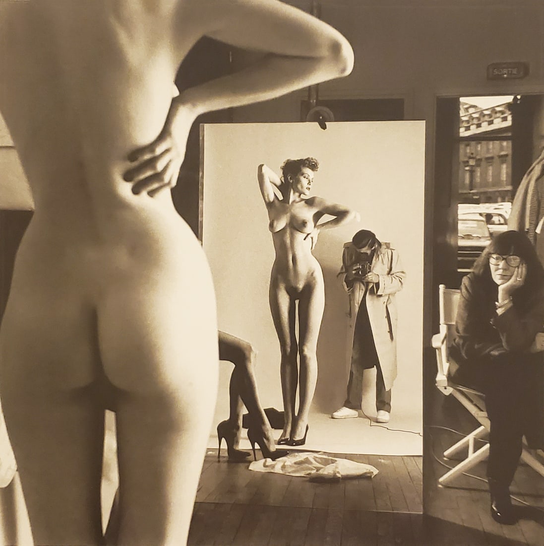 HELMUT NEWTON, SELF-PORTRAIT WITH WIFE AND MODELS, PARIS, 1981: Photographer: Helmut Newton (Germany, 1920 - 2004) - best known for his erotically charged highly stylized images, Helmut Newton was one of the most influential fashion photographers of all time. Titl