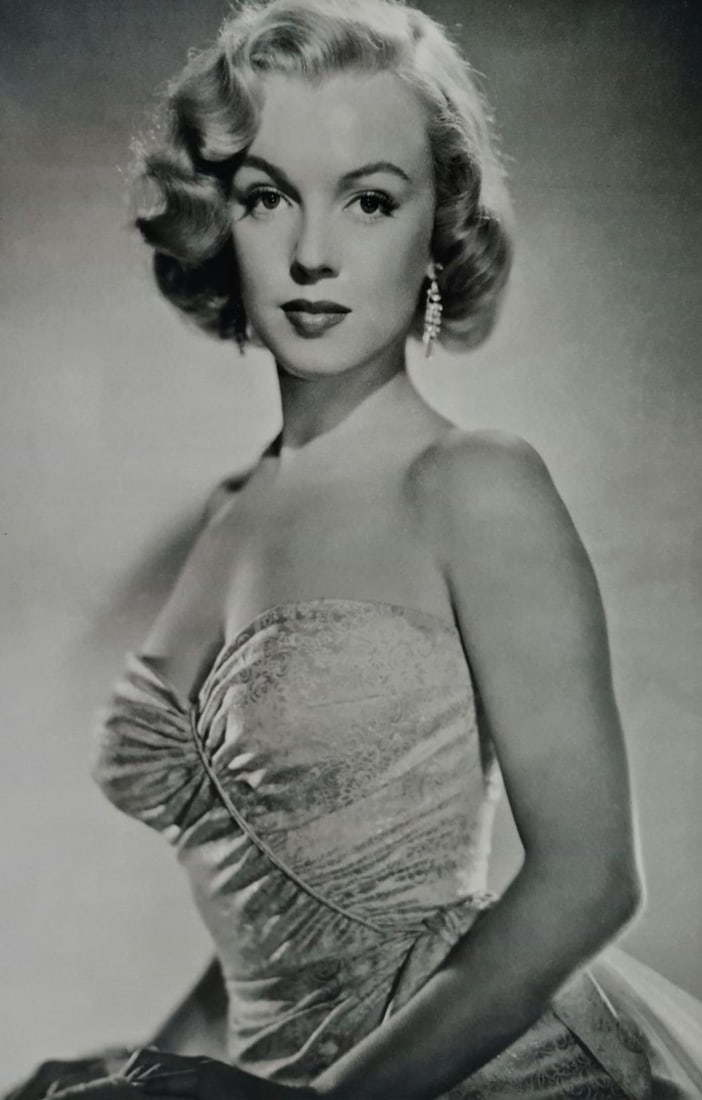 Marilyn Monroe in contemporary garb for publicity shot: Title: Marilyn Monroe in contemporary garb for publicity shot Year: Circa 1950's Size: 10.5" x 8" Medium: Duotone Photo Engraving Publisher: Parragon Published: 2008 Condition: Excellent Certificate o