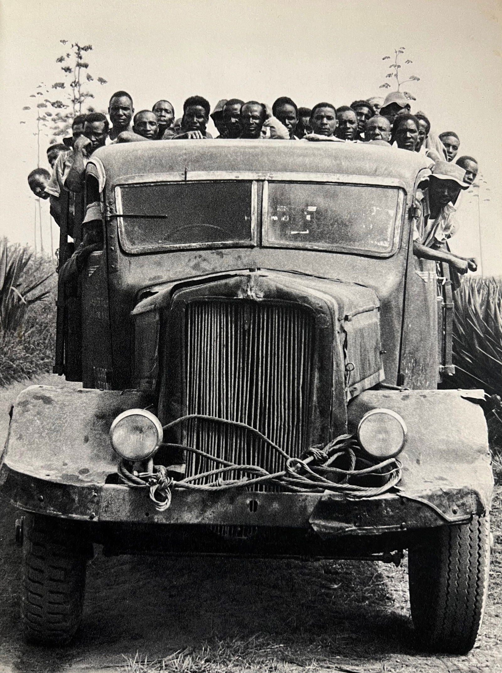 Peter Hill Beard, Plantation Workers Going To Collect Hippo Meat, 1960s: Photographer: Peter Hill Beard (January 22, 1938 – March 31 / April 19, 2020) was an American artist, photographer, diarist, and writer who lived and worked in New York City, Montauk and Kenya. His