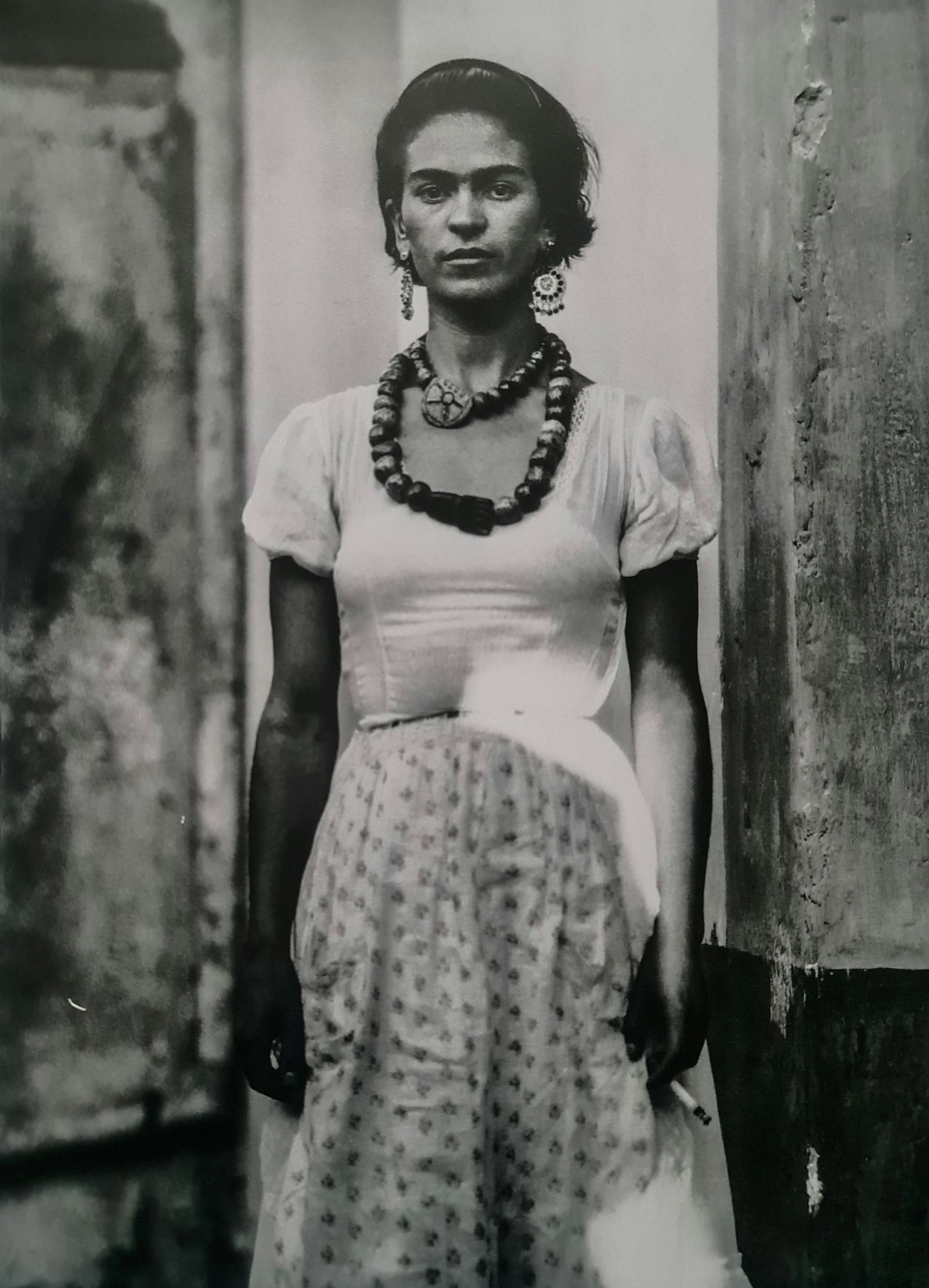 Frida Kahlo, Arms at her side: Subject: Arms at her side Subject/Title- Frida Kahlo Photos Type Of Print: Authentic Vintage Sheet Fed Photogravure/Heliogravure Date Of Print: 2021 Publisher: Taschen GmbH Paper: Medium weight, clay 