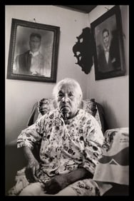Anthony Barboza, Anne Renee Gomes with photographs of her two late husbands, East Providence, Rhode