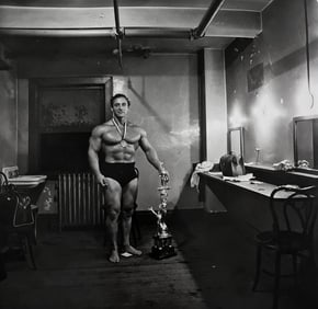 Diane Arbus, Muscle man in his dressing room with trophy, Broklyn, N.Y., 1962