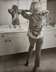 Marilyn Monroe looking in the mirror