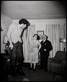 Diane Arbus, A Jewish giant at home with his parents in the Bronx, N.Y., 1970