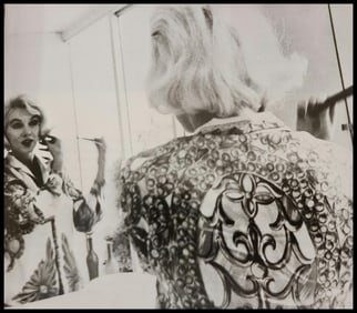 Marilyn Monroe doing her hair
