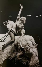 Carone, Marilyn Monroe riding a Barnum & Bailey elephant, 1955