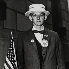 Diane Arbus, Boy with a straw hat waiting to march in a pro-war parade, N.Y.C., 1967