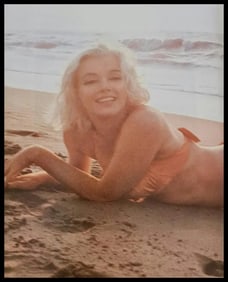 Marilyn Monroe on the beach in orange bikini